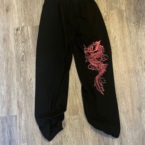 black sweats with red dragon